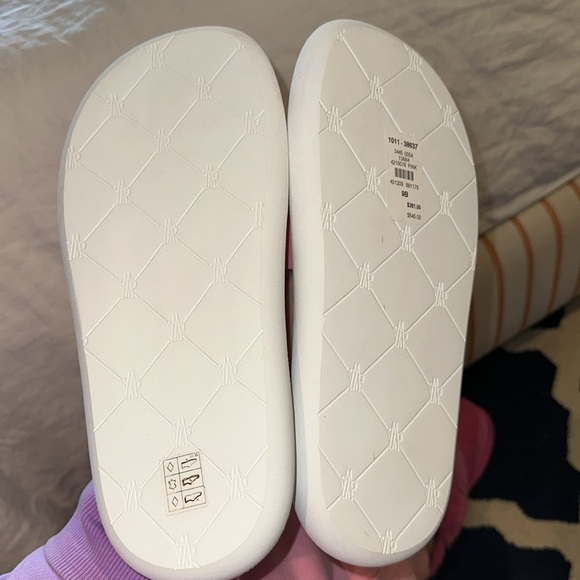 Pink Monclair slides in a size 9. Never been warm. - Picture 3 of 5